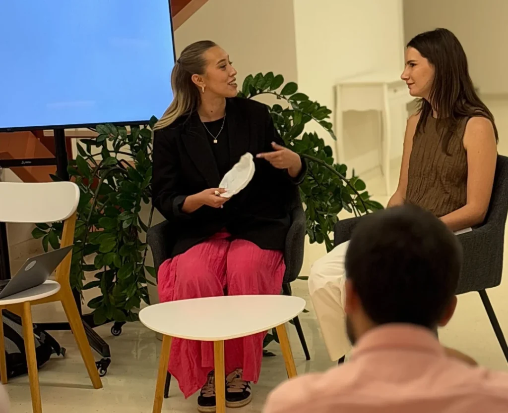 Two female colleagues participating in a demonstration during Naser Morina’s speech