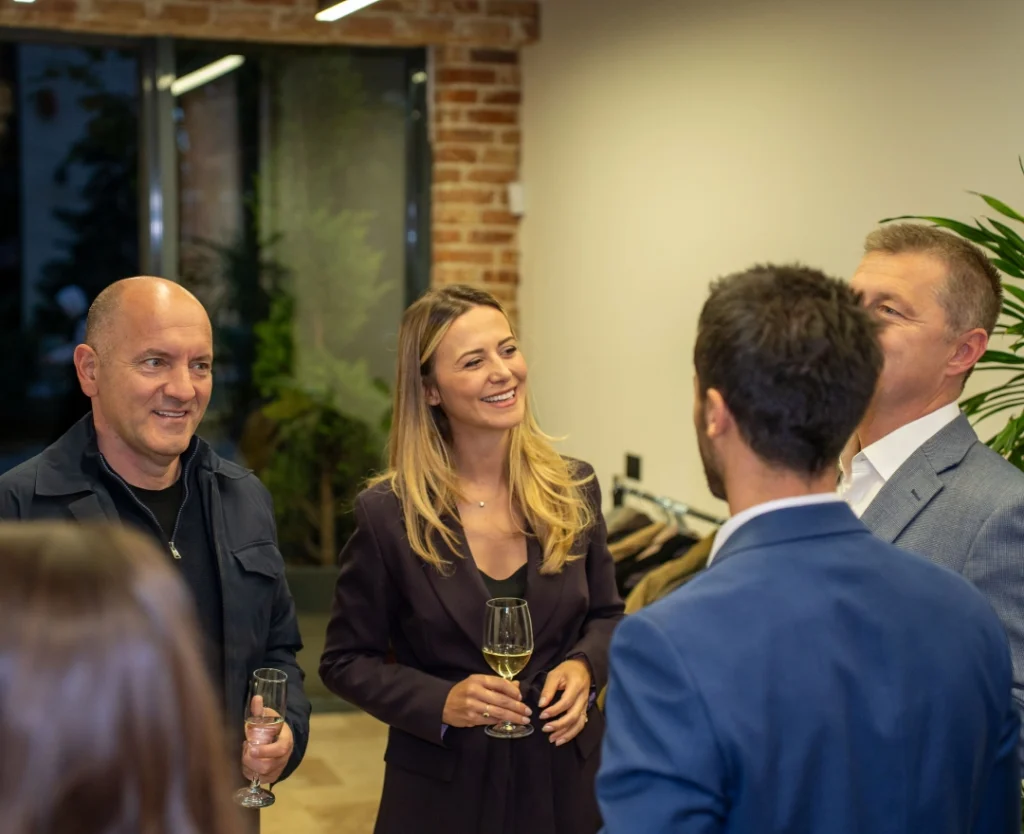 Jeta and Lum speaking to guests during the grand opening of AnchorzUp