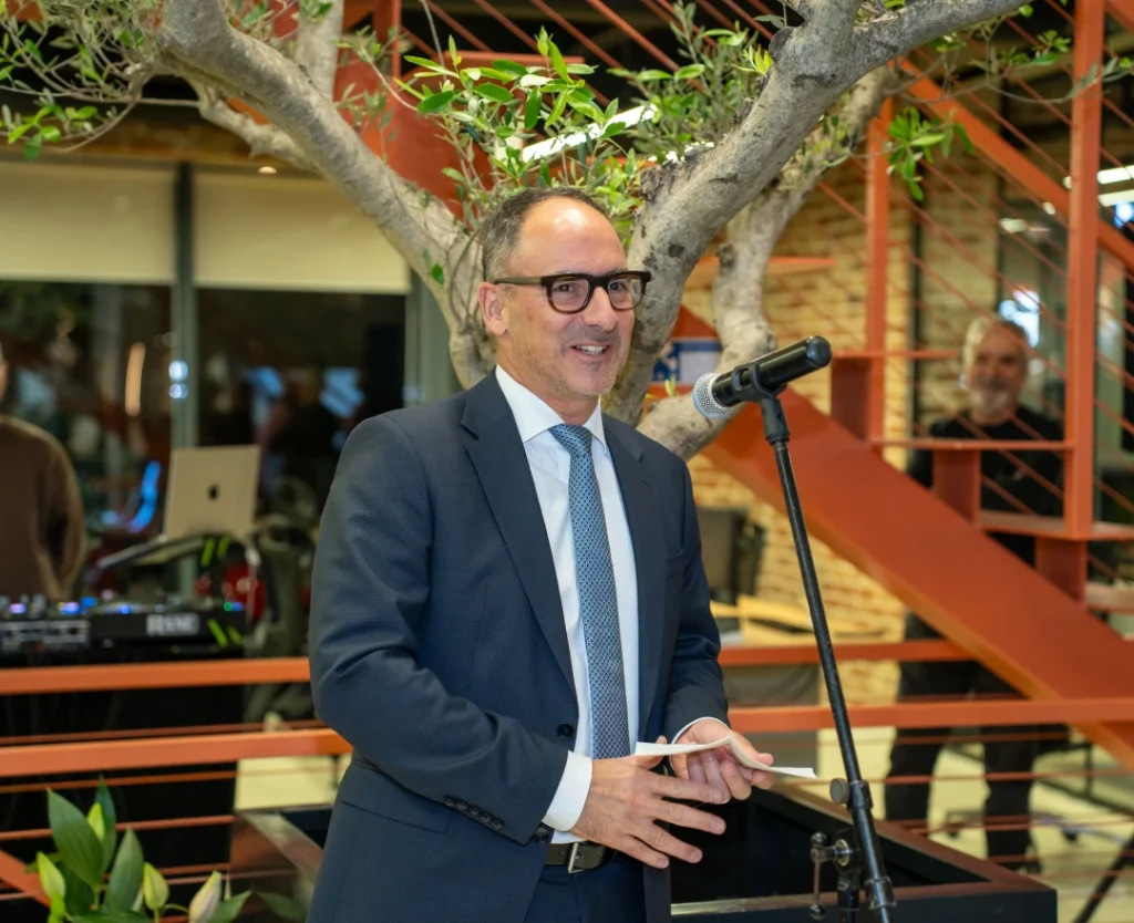 Mr. Christoph Fuchs from the Swiss Embassy speaking at AnchorzUp’s grand opening event.