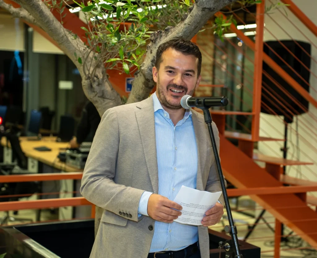 Pren Pervorfi speaking at AnchorzUp grand opening event